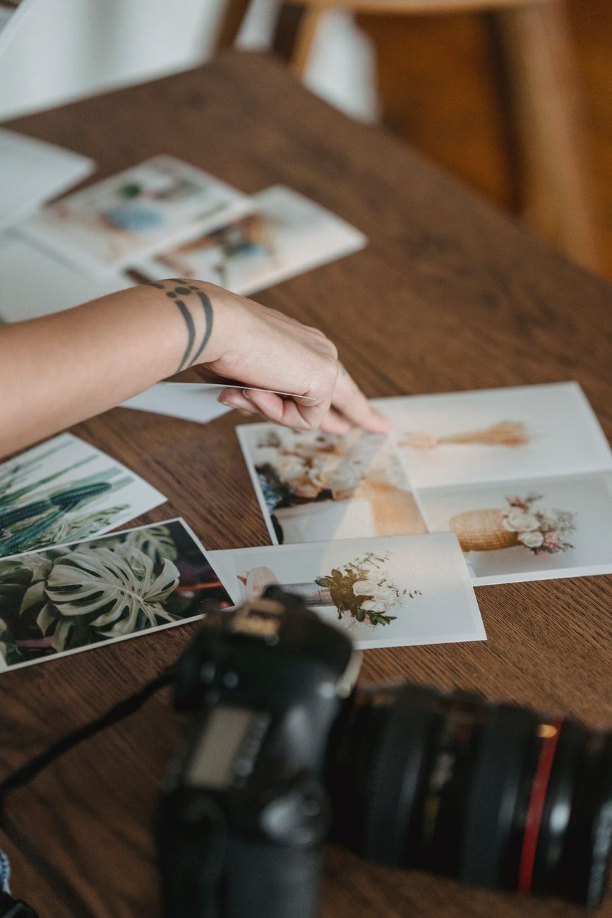Editorial team reviewing physical prints